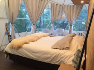 Cama o camas de una habitación en Glamping Domos Treepod