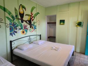 Postel nebo postele na pokoji v ubytování Jane's Beach Resort + 71 fotografií