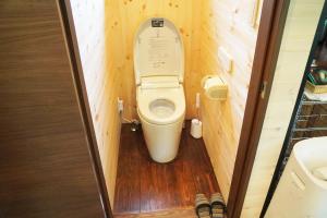 a bathroom with a toilet in a small room at POND CABIN Myoko - Vacation STAY 15921 in Myoko +14 photos
