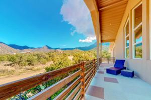 a balcony with a view of the mountains at Luxury of the Ritz set in the National Forest in Albuquerque