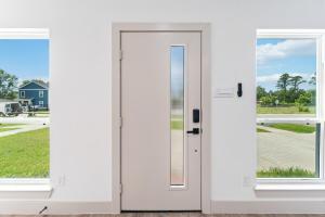 a white door with windows in a house at Little Nyssa Home away from Home in Houston