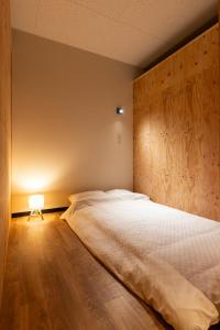 Una cama o camas en una habitación de くにまるイン