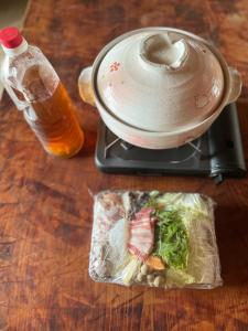 a table with a food processor and a bottle of beer at Hanadate Nature Park - Vacation STAY 46767v in Takabu