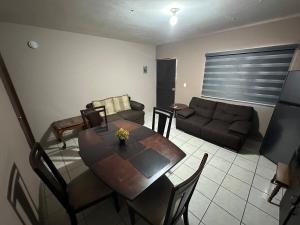 Posezení v ubytování Cómodo y acogedor departamento + 5 fotografií