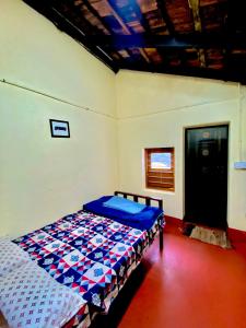 a bedroom with a bed in a room at Dreamland Vintage Homestay in Jambur