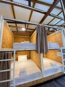 a couple of bunk beds in a room at Seaside Cenang in Pantai Cenang