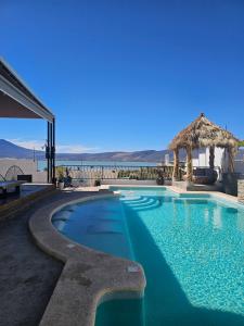 a swimming pool with a view of the ocean at The White House has everything in Chantepec