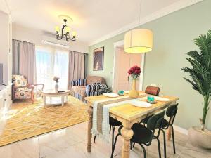 a living room with a table and a dining room at Stunning and warm near East Hub in Madinaty in Madinaty