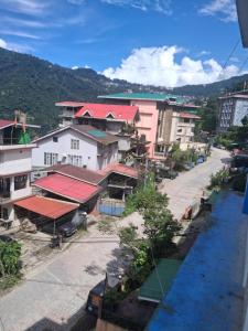 an overhead view of a city with buildings and a street at Nature Retreat in Gangtok