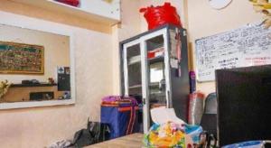a room with a counter and a shelf in a room at Capital O 91651 Independent99 Near Kalibata city square in Jakarta