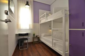 Łóżko lub łóżka w pokoju w obiekcie Far Home Atocha