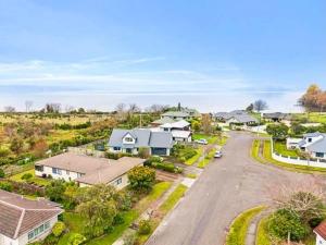 an aerial view of a residential neighborhood with houses at Zodiac Bay Lake Retreat in Rotorua
