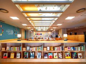 a book store with shelves of books at Comfort Hotel Hakata in Fukuoka