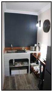 a small kitchen with a sink and a counter at brand st 95 in Brandfort