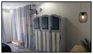 a room with white curtains and a pair of doors at brand st 95 in Brandfort