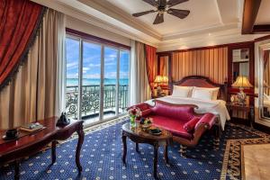 a hotel room with a bed and a large window at The IMPERIAL Vung Tau Hotel in Vung Tau +78 photos