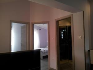 Postel nebo postele na pokoji v ubytování Apartment Diminic Melin