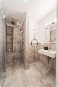 a bathroom with a shower and a sink at Private Studio Central Vienna in Vienna