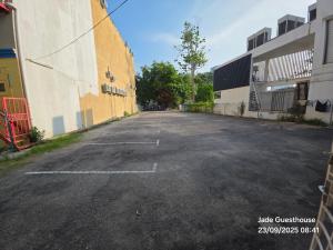 an empty parking lot next to a building at Jade Guesthouse Jonker Melaka in Melaka