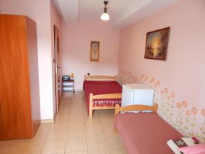 a living room with two beds in a room at Pokoje nad Potokiem in Solina