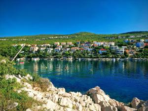 a small town on the shore of a body of water at Apartments and Rooms Lucia&Veronica in Dramalj