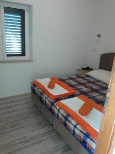 Postel nebo postele na pokoji v ubytování Apartment Cvijanović