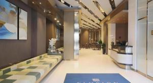 a lobby of a store with a long hallway at Elysion Place Hotel Causeway Bay in Hong Kong