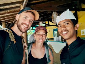 two men and a woman posing for a picture at Oasi Bungalow Gili Air in Gili Islands +60 photos