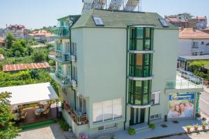 an aerial view of a white building with balconies at DebiMar in Chernomorets