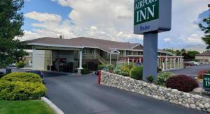 a sign in front of a building with a hotel at Airport Inn in Boise