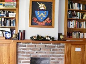 a fireplace with a picture on top of it at Fletcher Christian Holiday Hotel in Burnt Pine +158 photos