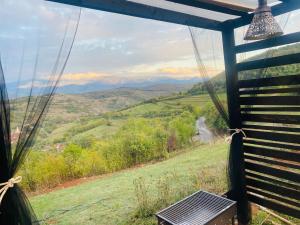 a view from a gazebo with a view of the mountains at Panorama Lupilor in Coleşti