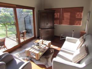 a living room with a couch and a coffee table at Caledon 31 in George +22 photos