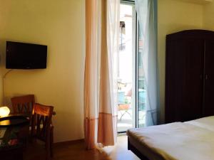 Postel nebo postele na pokoji v ubytování Bottega del Vino Guesthouse