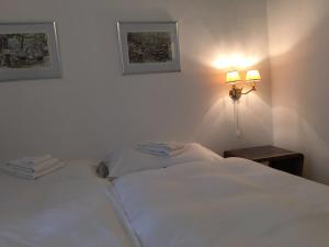 Postel nebo postele na pokoji v ubytování Bottega del Vino Guesthouse