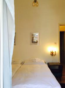 Postel nebo postele na pokoji v ubytování Bottega del Vino Guesthouse