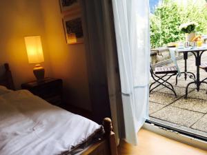 Postel nebo postele na pokoji v ubytování Bottega del Vino Guesthouse