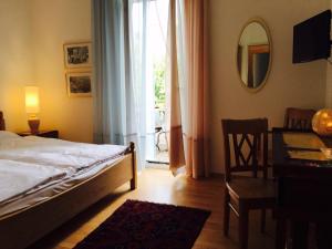Postel nebo postele na pokoji v ubytování Bottega del Vino Guesthouse