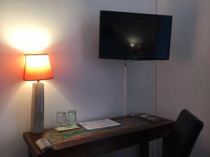 TV a/nebo společenská místnost v ubytování Bottega del Vino Guesthouse