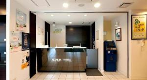 an entrance to a restaurant with a counter in a room at Super Hotel Hofu-Ekimae in Yamaguchi +176 photos