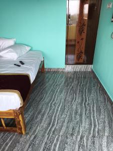 Postel nebo postele na pokoji v ubytování A Arumugam Residency AC and Non AC