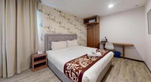 a hotel room with a bed and a window at Hotel LoLex Kuchai Lama in Kuala Lumpur +134 photos