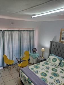 Ένα ή περισσότερα κρεβάτια σε δωμάτιο στο Minco Guesthouse