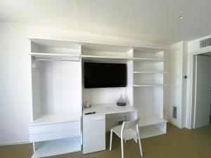 a white desk with a chair in a room at Agricola Chiani in Melendugno