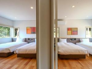 Ένα ή περισσότερα κρεβάτια σε δωμάτιο στο Mashiko life stay Amamaki +37 φωτογραφίες