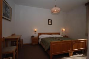 Postel nebo postele na pokoji v ubytování Hotel Ancora