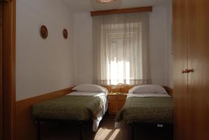 Postel nebo postele na pokoji v ubytování Hotel Ancora