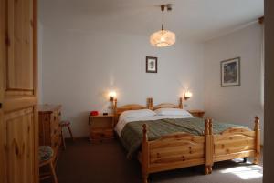 Postel nebo postele na pokoji v ubytování Hotel Ancora