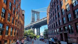 a view of a bridge from a street with buildings at NYC cozy & stylish 1 Bed Apt perfect for 4 guest in West New York