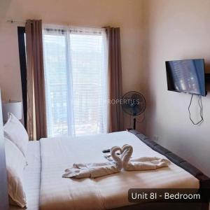 Ένα ή περισσότερα κρεβάτια σε δωμάτιο στο 8I Balai de Selendra Baguio City